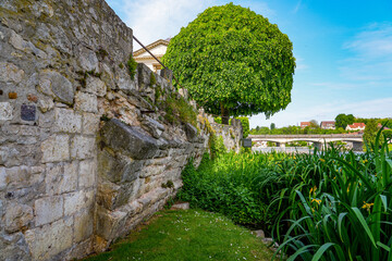 Remains of the footer of an old medieval bridge spanning the Loing river in Nemours, a small town in the south of the Seine et Marne department in Paris region, France