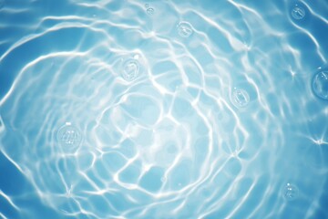 Blue water with ripples on the surface. Defocus blurred transparent blue colored clear calm water surface texture with splashes and bubbles. Water waves with shining pattern texture background.