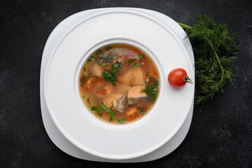 Aromatic red fish soup with tomatoes, garlic and spices
