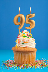 Birthday cake with candle number 95 - Blue background