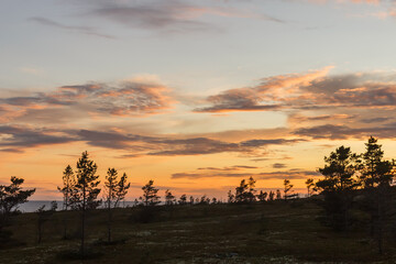 Sunset on the White Sea coast near Cape Ship. Amethyst coast.