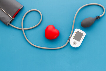 Red heart and blood pressure monitor. Heart diseases diagnosis concept