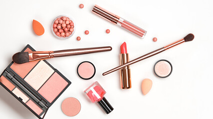 Beauty cosmetics makeup product flying in air cutout minimal. Woman make up collection falling on white background. Trendy fashionable layout. Cosmetology make-up advertising, top view.