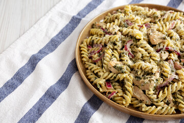 Homemade Creamy Lemon Butter Chicken Pasta on a Plate, side view. Space for text.