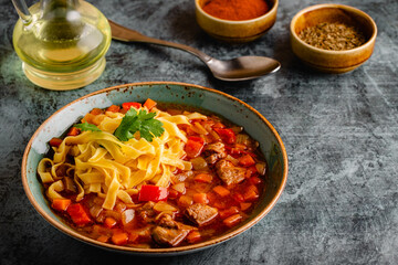 Lagman soup with lamb, homemade noodles and vegetables.