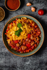 Lagman soup with lamb, homemade noodles and vegetables.