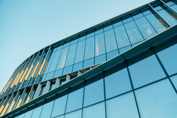 Glass Facade od Contemporary Corporatew Building with Sky, bottom view. Skyscraper Exterior. Architecture Details.