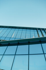 Glass Facade od Contemporary Corporatew Building with Sky, bottom view. Skyscraper Exterior. Architecture Details.