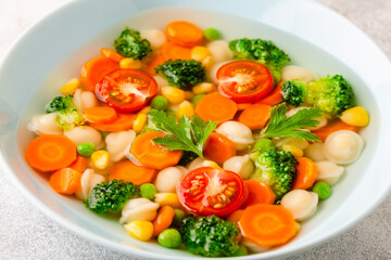 Soup with mini dumplings and vegetables.
