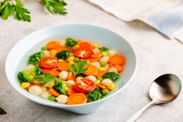 Soup with mini dumplings and vegetables.