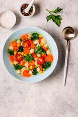Soup with mini dumplings and vegetables.