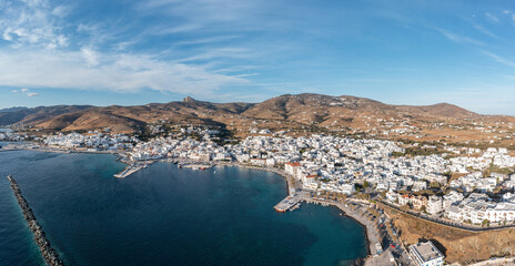 Fototapeta na wymiar Tinos island Hora town Cyclades destination Greece. Aerial drone view of harbor breakwater sea sky.