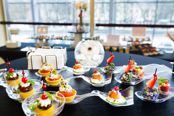 a buffet table with a variety of desserts on it. hotel conference coffee break idea
