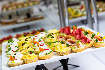 a table with a lot of different sandwitches on it. hotel conference coffee break idea
