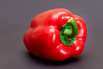 Fresh Red Sweet Bell Pepper on Black Background