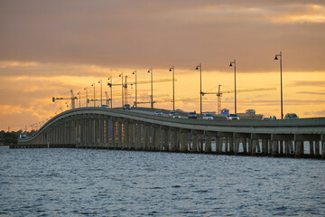 Fototapeta premium Barron Collier Bridge and Gilchrist Bridge in Florida with moving traffic. Transportation infrastructure in Charlotte County connecting Punta Gorda and Port Charlotte over Peace River