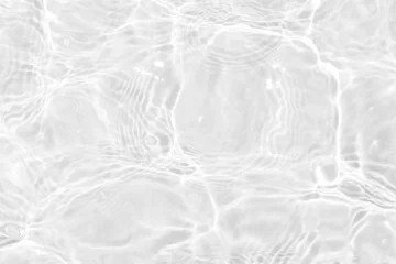 Fototapeten White water with ripples on the surface. Defocus blurred transparent white colored clear calm water surface texture with splashes and bubbles. Water waves with shining pattern texture background. © Water 💧 Shining 📸