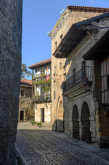 Obraz premium Santillana del Mar is a charming medieval town built around the Collegiate Church of Santa María. It is located in northern Spain in the Cantabria region.