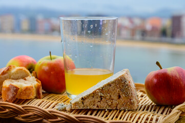 Asturias food and drink, blue cow cabrales cheese from Arenas served outdoor with glass of natural...