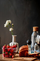 fresh strawberries and wine on kitchen