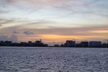 Huge buildings with sunset or sunrise, with sky and sea in a tropical island | Hiyaa flat of Maldives