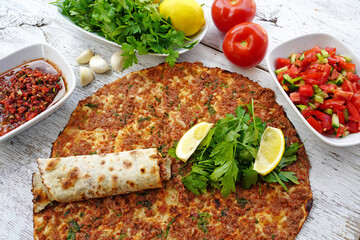 Lahmacun - Turkish food pide on wooden and near the garni 