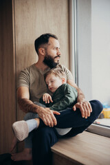 Father and Child Sharing a Serene Moment. Child sleeping in dad's arms.
