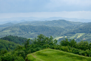 Fototapeta premium View of mountains and dense forest and beautiful blue sky before rain