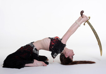 Belly dancer woman studio photography, belly dance is an art form of the dance.