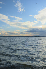 Obraz premium Landscape, view of the lake and the shore, green trees and water surface