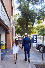 foreign tourist couple walking in santiago, chile