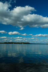 Landscape, view of the lake and the shore, green trees and water surface