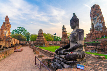 Buddha statue at the ancient temple of Wat Maha That in Ayutthaya - obrazy, fototapety, plakaty