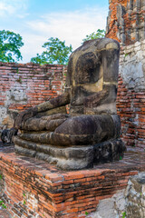 Headless Buddha at Wat Maha That temple, A UNESCO World Heritage site in Ayutthaya. Ancient historic temple ruins from previous era of the Kingdom of Thailand