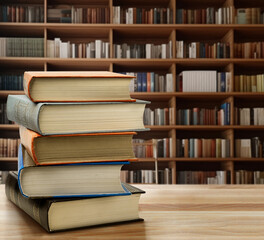 Book stack on the desk in public library