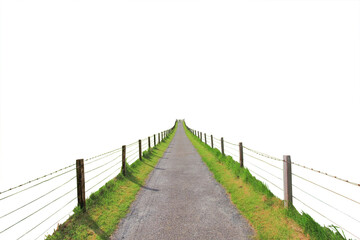 Cutout of an isolated small farm road with fences leading to the wooden gate on  a hill  with the...