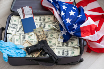 Suitcase with pile of dollars. Opened silver case with money. Better to have bank account. Part of city budget.