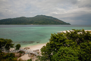 aerial view of Tropical island rock on the beach with blue sky and green tree, Kha kha beach Pattani thailand
