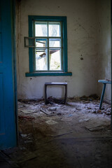 Fototapeta na wymiar Classroom in an abandoned school with notebooks on desks in the exclusion zone of Belarus.