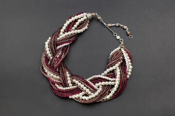 Purple beads and pearls necklace on black, unique handmade jewelry background