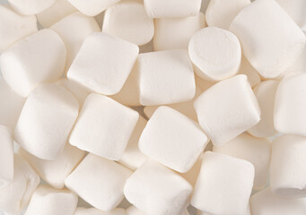 Marshmallows textures. Marshmallows food background. Heap of white air marshmallows candies texture or background