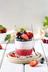 Summer dessert with berries, chia seeds and cream. 