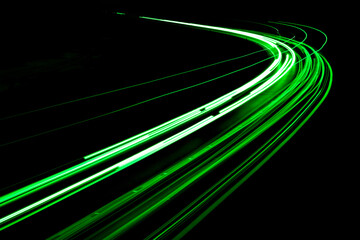 Fototapeta na wymiar green car lights at night. long exposure