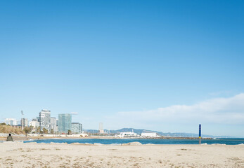 A woman enjoying the view over Playa Mar, Barcelona (Spain).