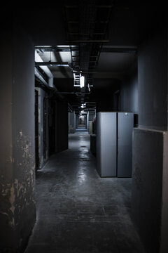 View Of A Narrow Dark Corridor Inside A Prison