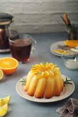 A sweet citrus cake served with oranges and lemons