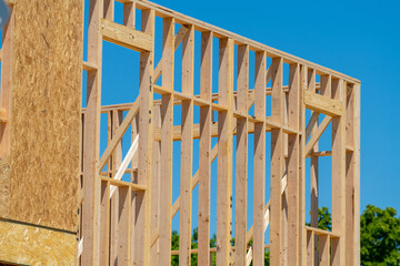 frame of a plywood house against the blue sky formwork beam board