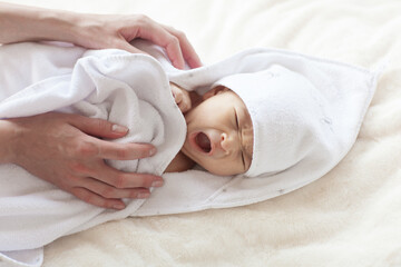 Obraz na płótnie Canvas Cute newborn baby during care procedures.