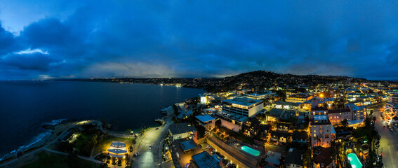 La Jolla Cove from a UAV Drone Aerial View looking at Downtown La Jolla, California, and the Hills at Night
