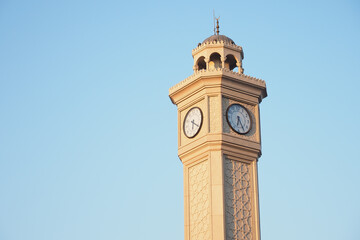 Fototapeta na wymiar clock in a old tower against blue sky in turkey 